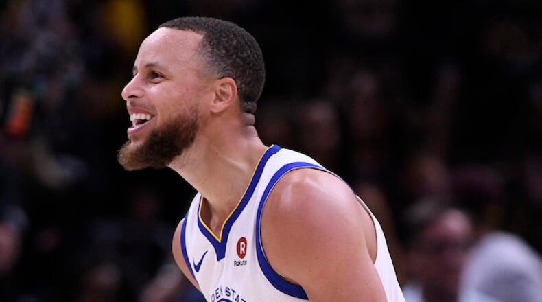 The Golden State Warriors' Stephen Curry reacts after making a 3-point basket against the Cleveland Cavaliers during the final minute of fourth quarter of Game 3 of the NBA Finals at Quicken Loans Arena in Cleveland, Ohio, on Wednesday, June 6, 2018. (Jose Carlos Fajardo/Bay Area News Group/TNS)