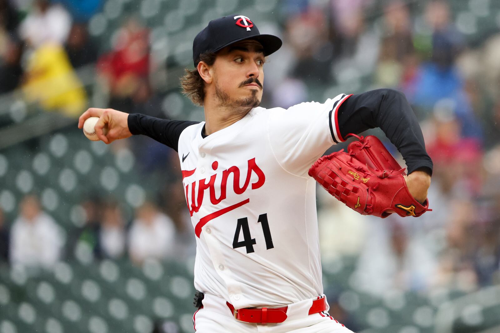 Minnesota Twins pitcher Joe Ryan throws to the Cleveland Guardians during the fourth inning of a baseball game that was suspended Monday because of rain and resumed, Wednesday, May 21, 2025, in Minneapolis. (AP Photo/Ellen Schmidt)