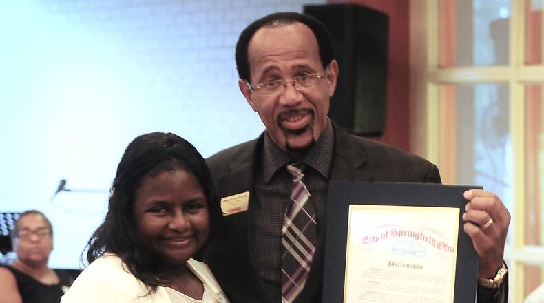 Eddie Chambers, Director of Wittenberg University Upward Bound Program and City of Springfield Vice-Mayor Joyce Chilton are pictured holding the proclamation presented by Vice-Mayor Chilton for the 50th year of Upward Bound at Wittenberg University. Upward Bound is a program to help low income or under privileged students to obtain access to college. CONTRIBUTED