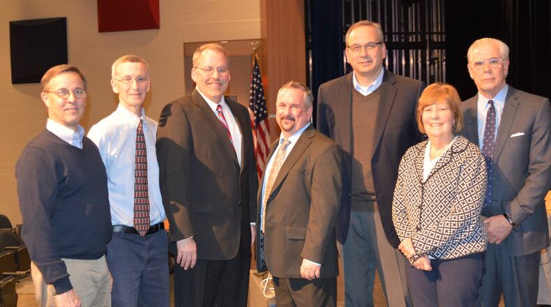 Ed Theroux, center, poses with Talawanda district officials following the board meeting Monday when he was formally hired to be the next superintendent. Pictured are, from lef, board members Chris Otto, Patrick Meade, Michael Crowder, Theroux, Mark Butterfield and Mary Jane Roberts and District Treasurer and CFO Mike Davis. CONTRIBUTED/BOB RATTERMAN