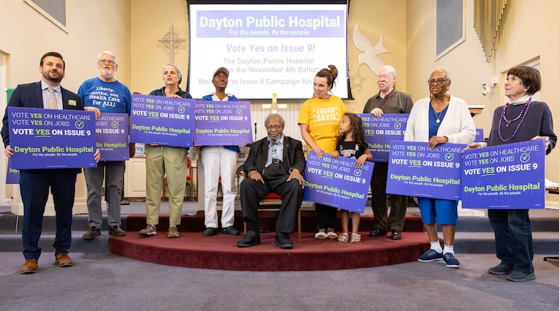 Volunteers in support of the passage of Issue 9 recite a chant urging voters to approve the levy during a meeting on Tuesday, Sept. 23 at College Hill Community Church in western Dayton. If passed, the levy would raise $2 million in support of a new public hospital in West Dayton. BRYANT BILLING / STAFF
