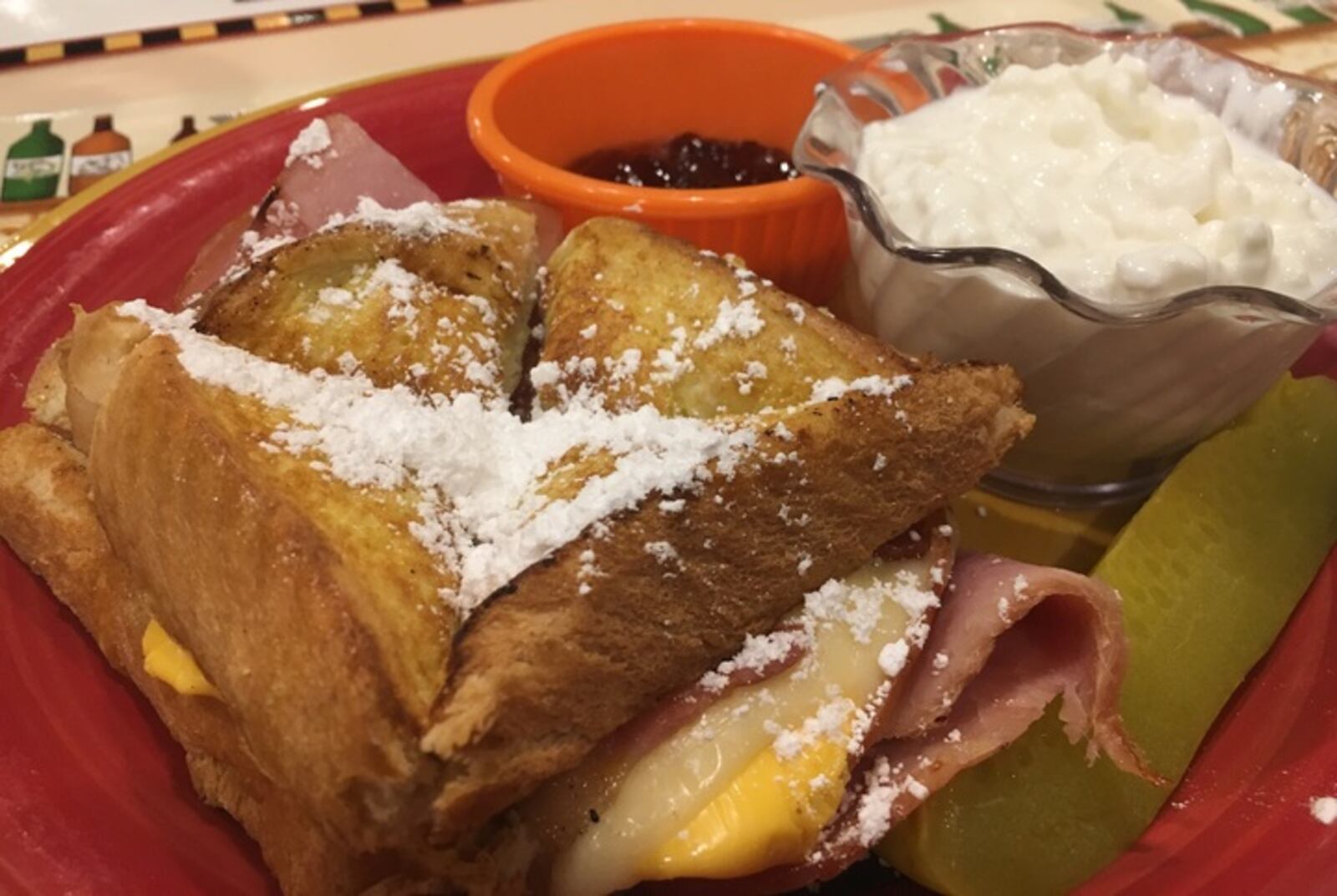 The Masonic Cristo, served with ham, turkey, maple bacon and cheddar and Swiss cheeses on French toast with strawberry jam, is one of the most popular items on the menu.