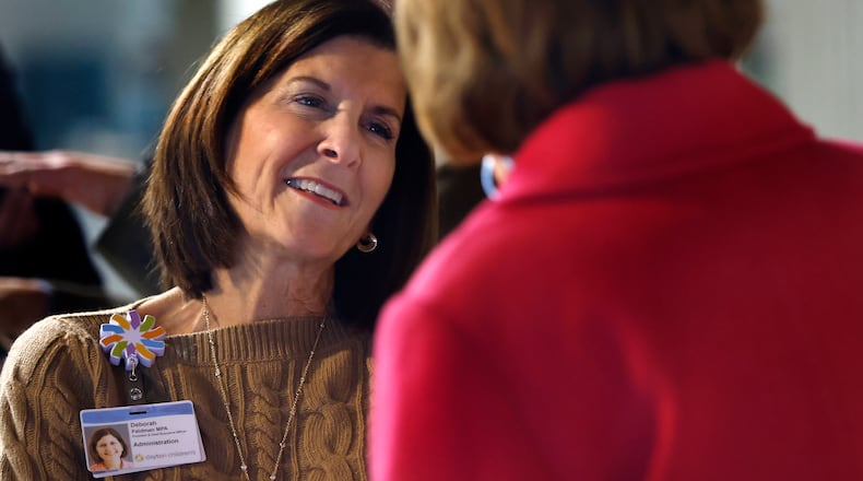 Deborah Feldman, President and CEO, Dayton Children's Hospital talks with Montgomery County Commissioner Judy Dodge Thursday, Dec. 5, 2024 during the Dayton Children's Hospital indoor ground breaking. MARSHALL GORBY\STAFF