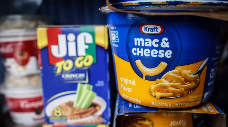 Nonperishable food is stocked in the mini food pantry Oakview Elementary School on Ackerman Blvd. in Kettering. JIM NOELKER/STAFF