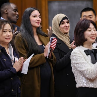Forty-six immigrants became United States citizens during a naturalization ceremony on Thursday, Dec. 18 at the Walter H. Rice Federal Building in downtown Dayton. Rice presided over the ceremony. BRYANT BILLING/STAFF