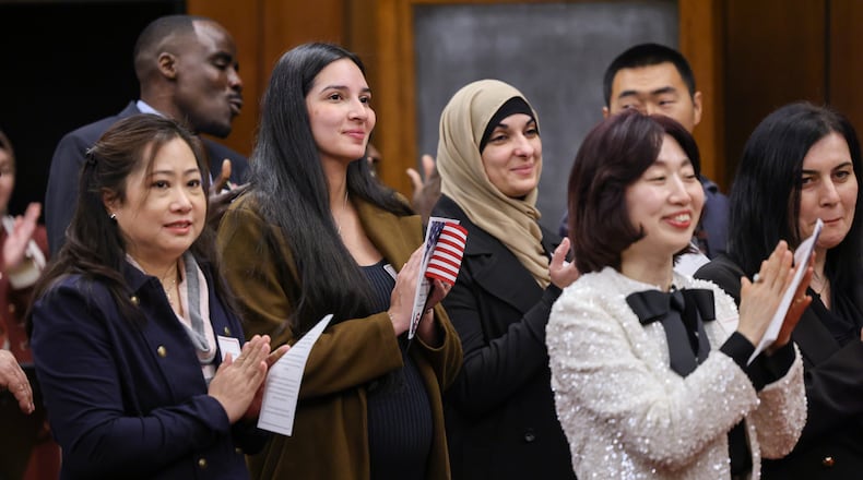 Forty-six immigrants became United States citizens during a naturalization ceremony on Thursday, Dec. 18 at the Walter H. Rice Federal Building in downtown Dayton. Rice presided over the ceremony. BRYANT BILLING/STAFF
