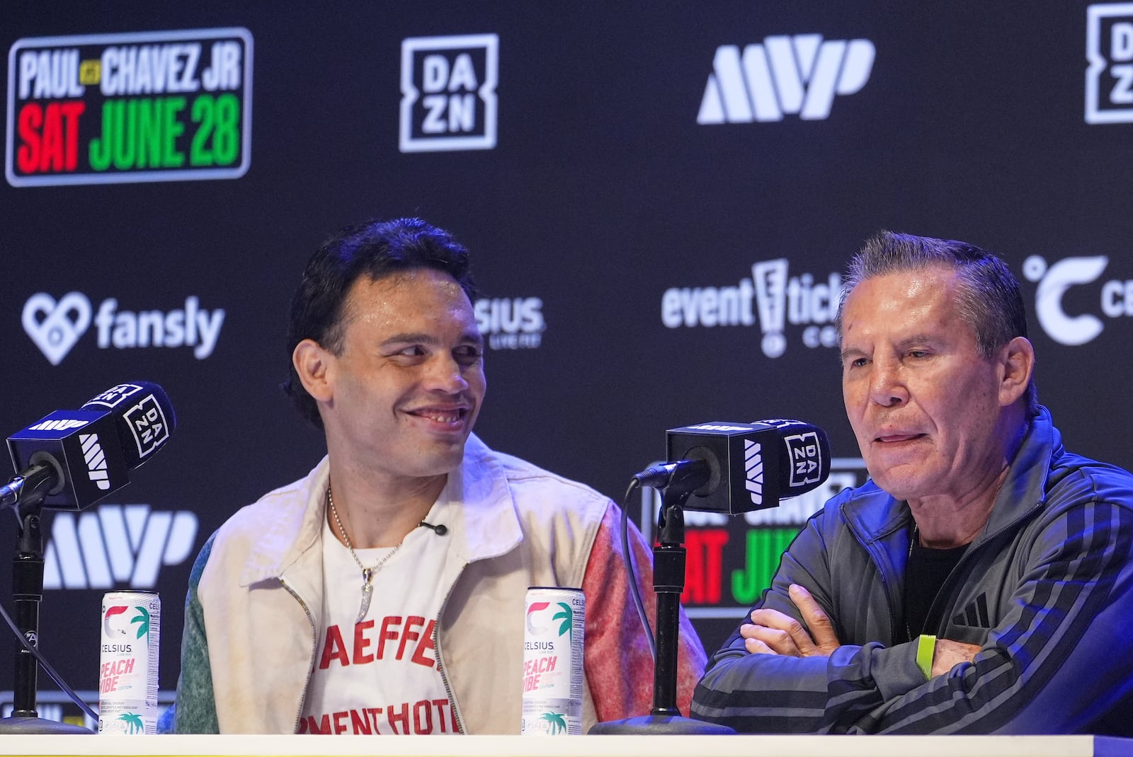FILE - Boxers Cesar Chavez Jr,, left, smiles towards his father Julio Cesar Chavez, Mexico's former world champion, during a boxing news conference at the Avalon Hollywood Theatre in Los Angeles, May 14, 2025. (AP Photo/Damian Dovarganes, File)
