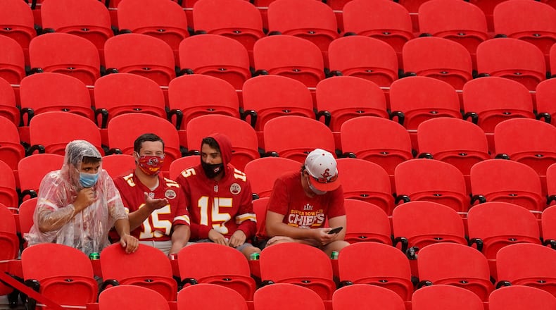 Fans watch the Kansas City Chiefs during NFL football training camp Saturday, Aug. 29, 2020, at Arrowhead Stadium in Kansas City, Mo. The Chiefs opened the stadium to 5,000 season ticket holders to watch practice as the team plans to open the regular season with a reduced capacity of approximately 22 percent of normal attendance. (AP Photo/Charlie Riedel)