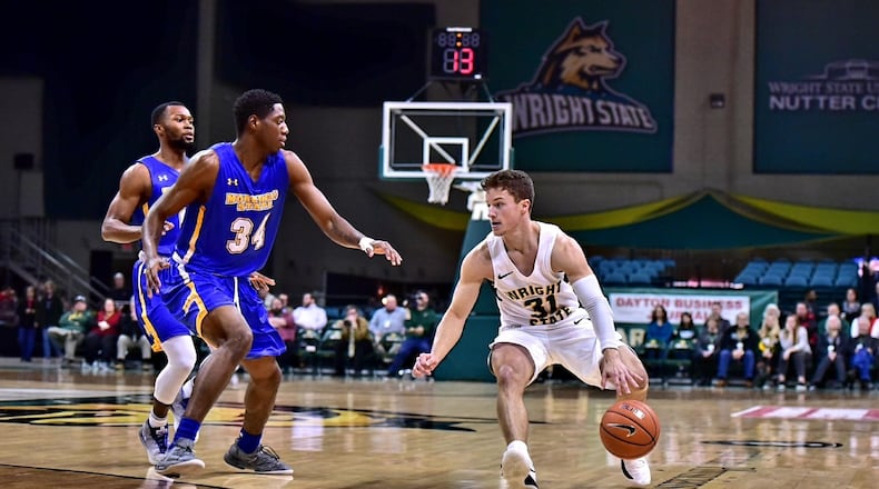 Wright State point guard Cole Gentry looks for room to maneuver during a game vs. Morehead State at the Nutter Center. Joseph Craven/Wright State Athletics