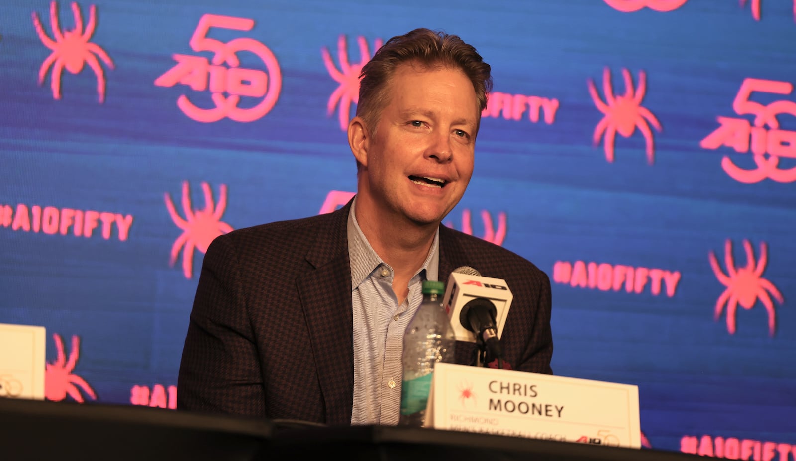 Richmond's Chris Mooney speaks at Atlantic 10 Conference Media Day on Tuesday, Sept. 30, 2025, in Pittsburgh. David Jablonski/Staff