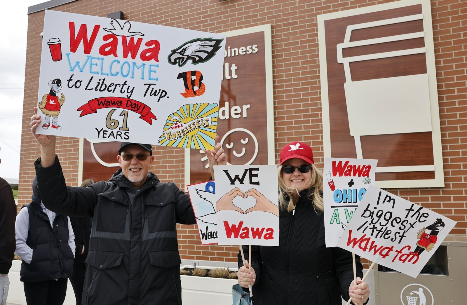 Jean and Henry Toudy, from Monroe, wait in line for a VIP event Tuesday, April 15, 2025 for Ohio's first Wawa on Cincinnati Dayton Road in Liberty Township. The grand opening is Wednesday. NICK GRAHAM/STAFF