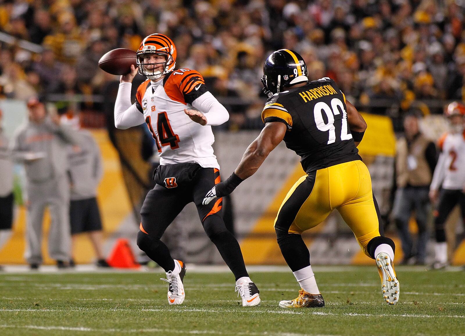 PITTSBURGH, PA - DECEMBER 28: Andy Dalton #14 of the Cincinnati Bengals throws a pass in front of James Harrison #92 of the Pittsburgh Steelers during the first quarter at Heinz Field on December 28, 2014 in Pittsburgh, Pennsylvania. (Photo by Justin K. Aller/Getty Images)