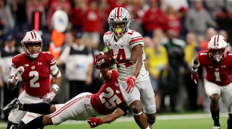 INDIANAPOLIS, INDIANA - DECEMBER 07: K.J. Hill #14 of the Ohio State Buckeyes runs the ball in for touchdown in the Big Ten Championship game against the Wisconsin Badgers during the third quarter at Lucas Oil Stadium on December 07, 2019 in Indianapolis, Indiana. (Photo by Justin Casterline/Getty Images) ***BESTPIX***