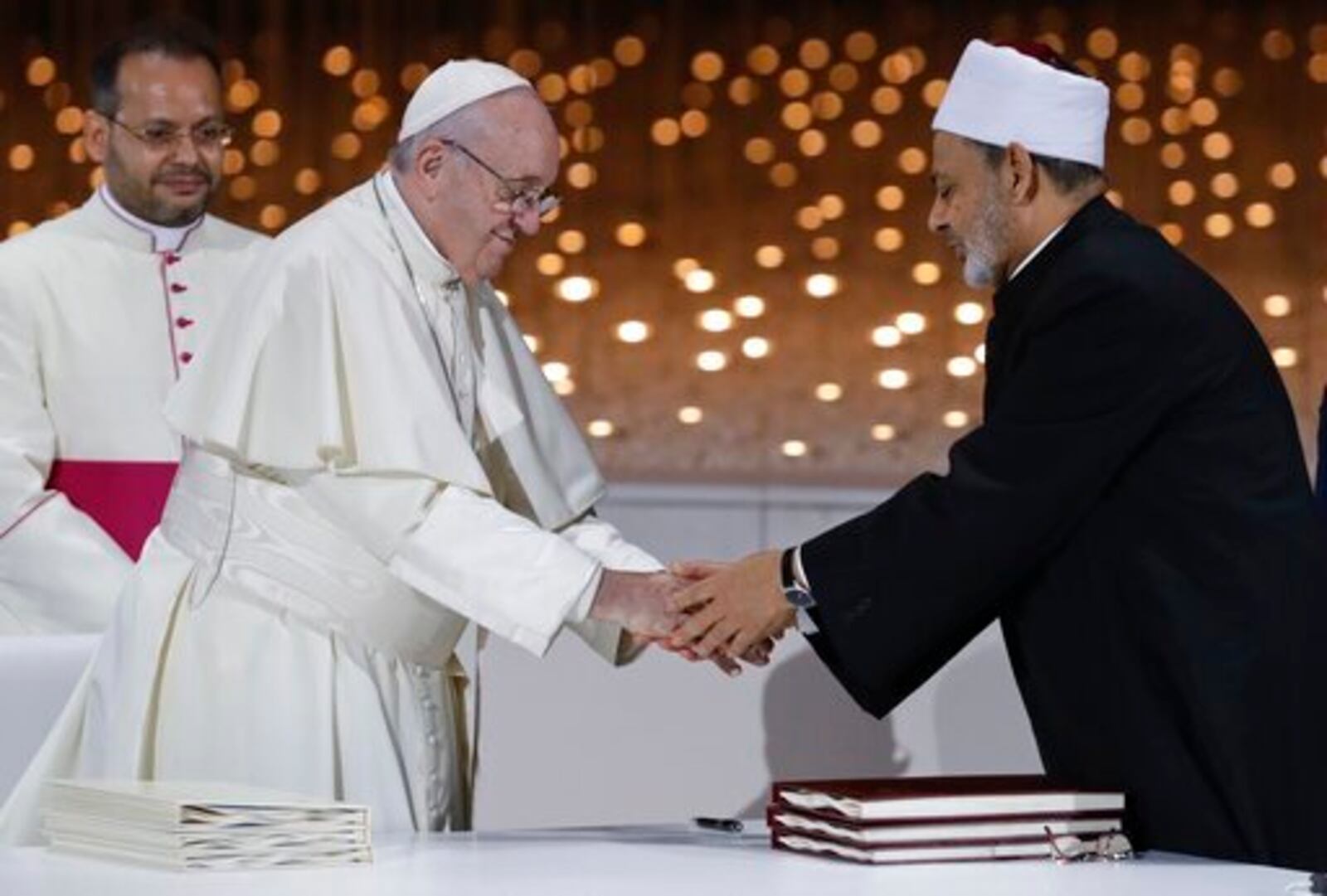 FILE - Pope Francis greets Sheikh Ahmed el-Tayeb, the grand imam of Egypt's Al-Azhar, after an Interreligious meeting at the Founder's Memorial in Abu Dhabi, United Arab Emirates, Wednesday, Feb. 4, 2015. (AP Photo/Andrew Medichini, file)