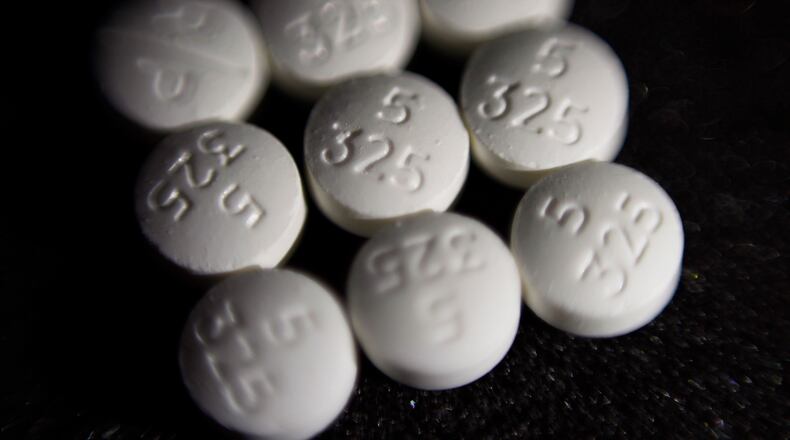 FILE - This Aug. 15, 2017 file photo shows an arrangement of pills of the opioid oxycodone-acetaminophen, also known as Percocet, in New York. Ohio is ready to begin distributing millions of dollars in opioid settlement money to community and government organizations, an influx eagerly anticipated since the first sums were secured in 2021. The OneOhio Recovery Foundation, which has been tasked with distributing over $860 million of settlements reached with drugmakers and pharmaceutical companies for their roles in the national opioid crisis, plans to release its formal request for proposals Monday, March 4, 2024. (AP Photo/Patrick Sison, File)