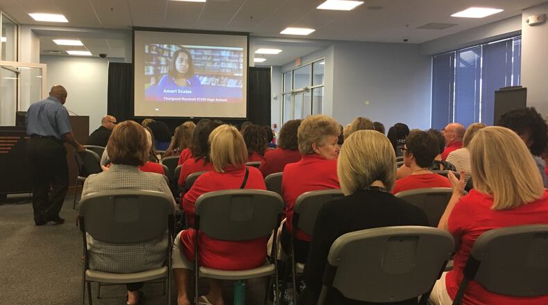 Dayton Public Schools teachers and other staff watch a back-to-school presentation from district leadership Thursday morning. JEREMY P. KELLEY / STAFF