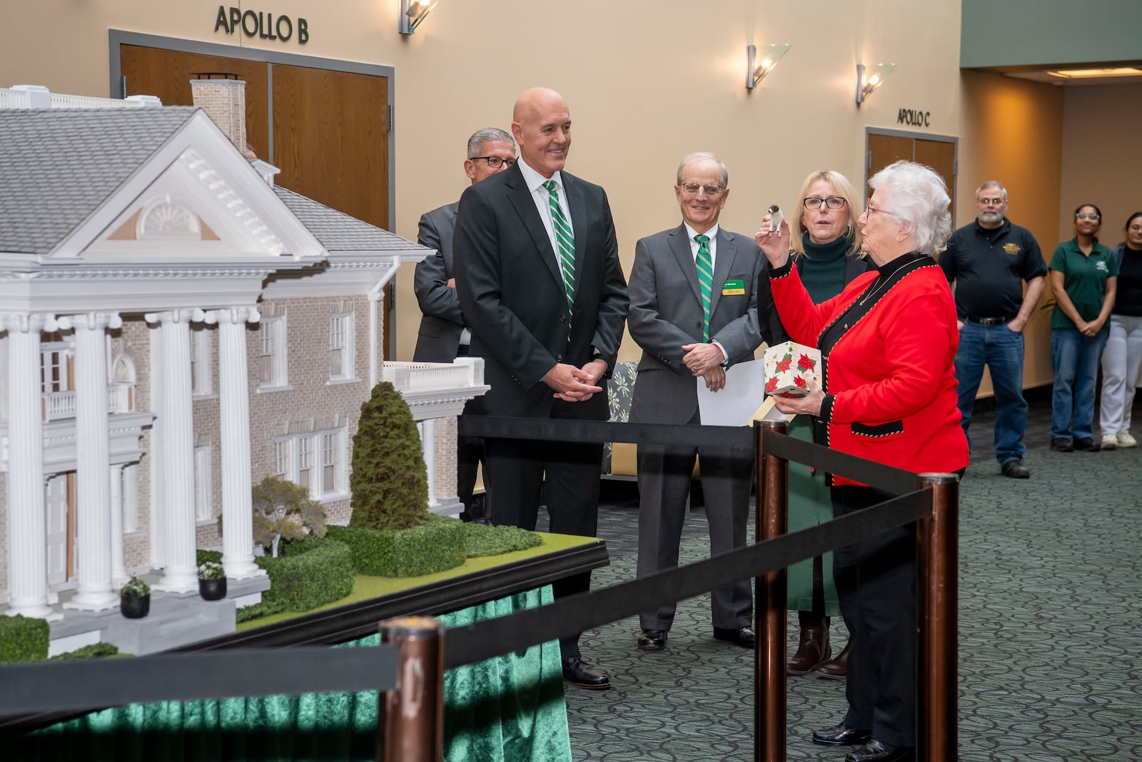 Helen Naughton presents a model of Scipio, the dog of Orville Wright to Greg Sample, executive vice president and chief operating officer of Wright State University. Naughton donated a replica of Hawthorn Hill, the Wright brothers’ home, to Wright State University. Contributed by Wright State University