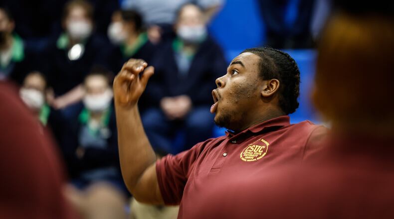 Xavier Wilson conducts the Central State University Chorus at the Dayton Correctional Institution. About 100 inmates watched the performance as a part of the institution's Black History Month programming. JIM NOELKER/STAFF