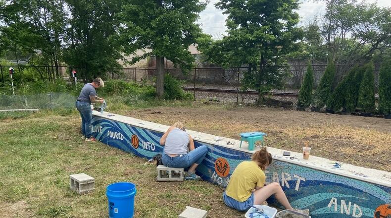Installation of the Our Town Dayton mosaic project, which will be dedicated June 22. CONTRIBUTED