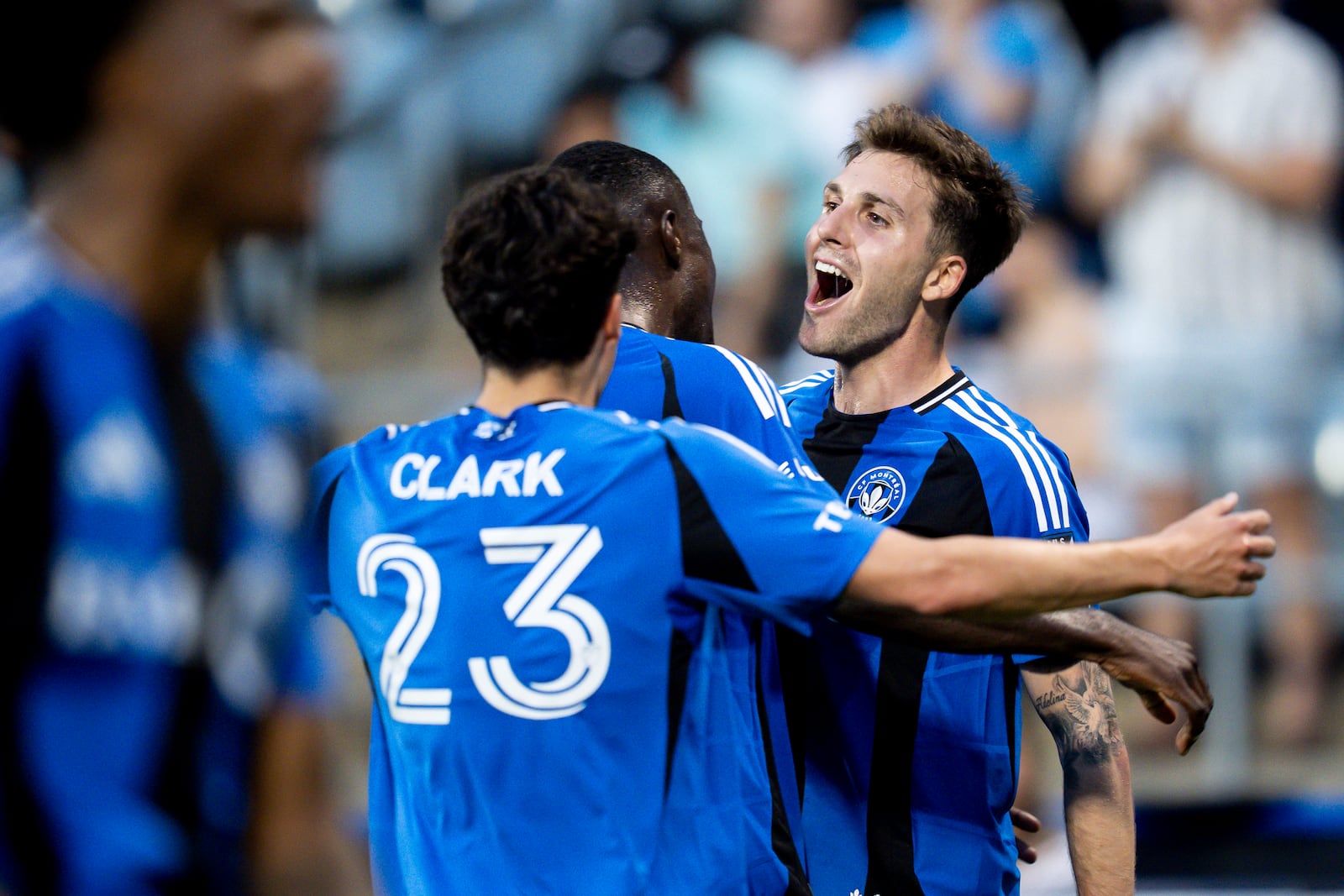 CF Montreal's Luca Petrasso, right, celebrates with teammates after scoring during first half MLS soccer action against the Columbus Crew in Montreal, Quebec Wednesday, May 14, 2025. (Christopher Katsarov/The Canadian Press via AP)