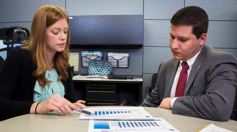 Matthew Moore (right) receives inputs on a document from his supervisor, Stephanie Hilgeford, working capital fund chief, Sept. 17 at Air Force Materiel Command, Wright-Patterson Air Force Base. Moore is considered disabled with dyslexia and ADHD. He secured in internship earlier in the year through AFMC’s Workforce Recruitment Program, which has since lead to a permanent position at Wright-Patterson. (U.S. Air Force photos/Jim Varhegyi)