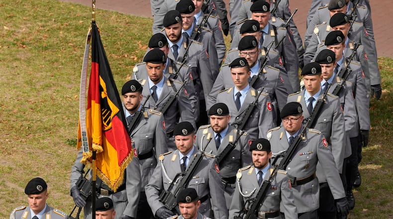 FILE - New recruits of the German Army Bundeswehr attend a ceremony to take their oath in front of the North Rhine-Westphalia state parliament in Duesseldorf, Germany, on Sept. 4, 2025. (AP Photo/Martin Meissner, File)