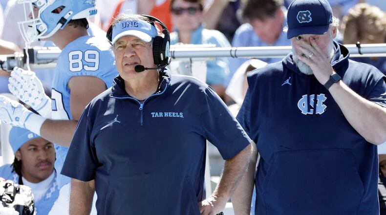 North Carolina head coach Bill Belichick, left, watches during the first half of an NCAA college football game against Clemson, Saturday, Oct. 4, 2025, in Chapel Hill, N.C. (AP Photo/Chris Seward)