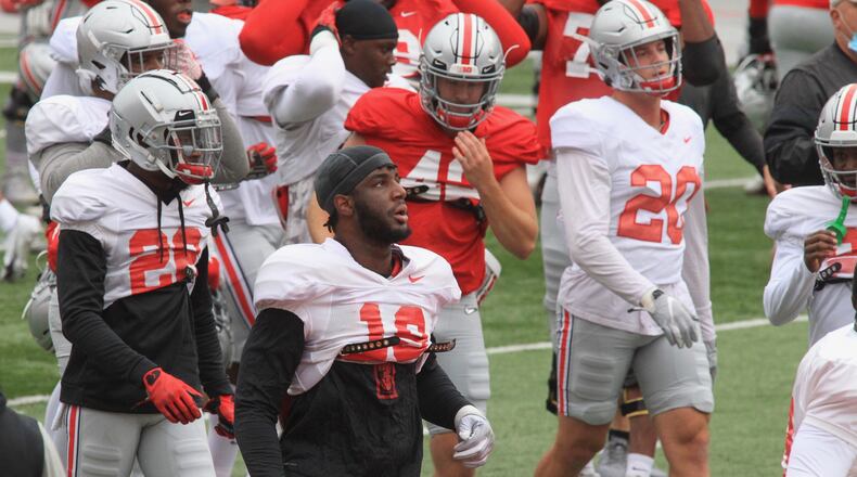 Ohio State players, including Dallas Gant, center, practice at Ohio Stadium on Saturday, Oct. 3, 2020, in Columbus. David Jablonski/Staff