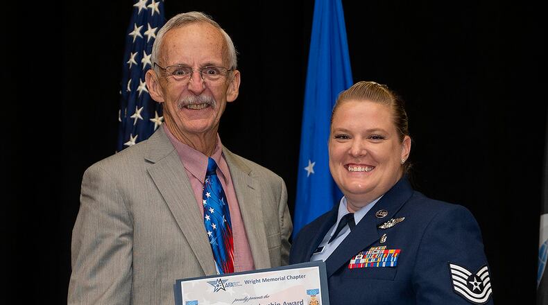 Tech Sgt. Jennafer Sawyer receives the Pitsenbarger Scholarship on June 15 from Air and Space Forces Association Wright Memorial Chapter during the Community College of the Air Force Spring 2022 graduation ceremony at the National Museum of the Air Force. The scholarship is a cash award to be used in the continuation of education beyond the associate degree level. U.S. AIR FORCE PHOTO/R.J. ORIEZ