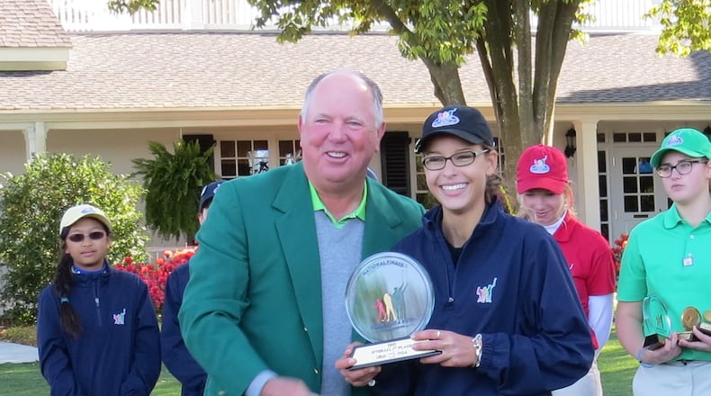Kings High School freshman Alex Swayne poses with golfer Mark O’Meara after she won the National Drive, Chip and Putt compeitition at Augusta National Golf Club. CONTRIBUTED