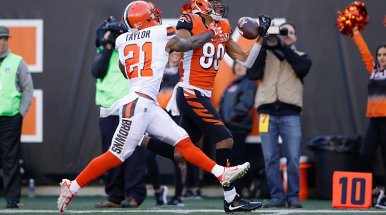 CINCINNATI, OH - NOVEMBER 26: Josh Malone #80 of the Cincinnati Bengals tries to make a one-handed catch against Jamar Taylor #21 of the Cleveland Browns in the second half of a game at Paul Brown Stadium on November 26, 2017 in Cincinnati, Ohio. The Bengals won 30-16. (Photo by Joe Robbins/Getty Images)