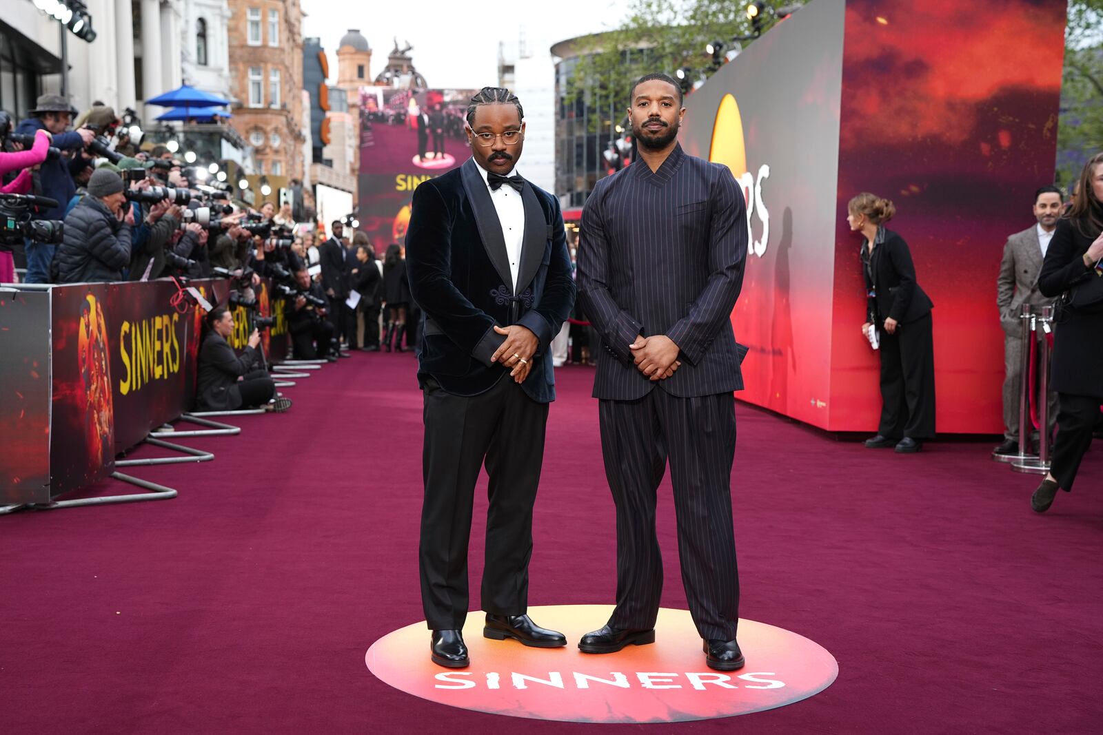 Director Ryan Coogler, left, and Michael B. Jordan pose for photographers upon arrival at the premiere of the film 'Sinners' on Monday, April 14, 2025, in London. (Photo by Scott A Garfitt/Invision/AP)