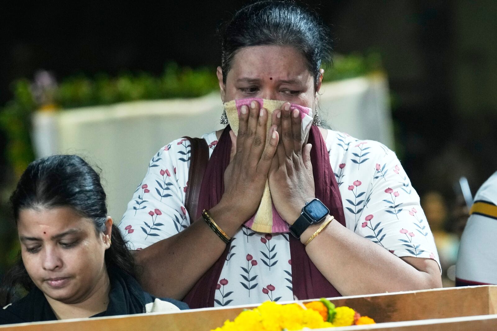 A relative of Hemant Joshi, who was a victim in a deadly attack on tourists in the Pahalgam region of Indian-administered Kashmir, reacts at Dombivali near Mumbai, India, Wednesday, April. 23, 2025.(AP Photo/Rajanish Kakade)