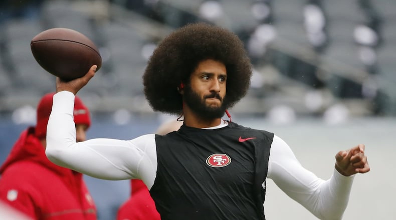 San Francisco 49ers quarterback Colin Kaepernick warms up before an NFL football game against the Chicago Bears in December.