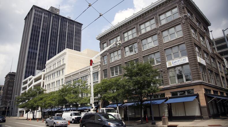Dayton Public Schools plans to close the 115 S. Ludlow St. building where central office staff currently work and move to these DPS buildings across the street, at the northeast corner of Ludlow and Fifth Street. TY GREENLEES / STAFF