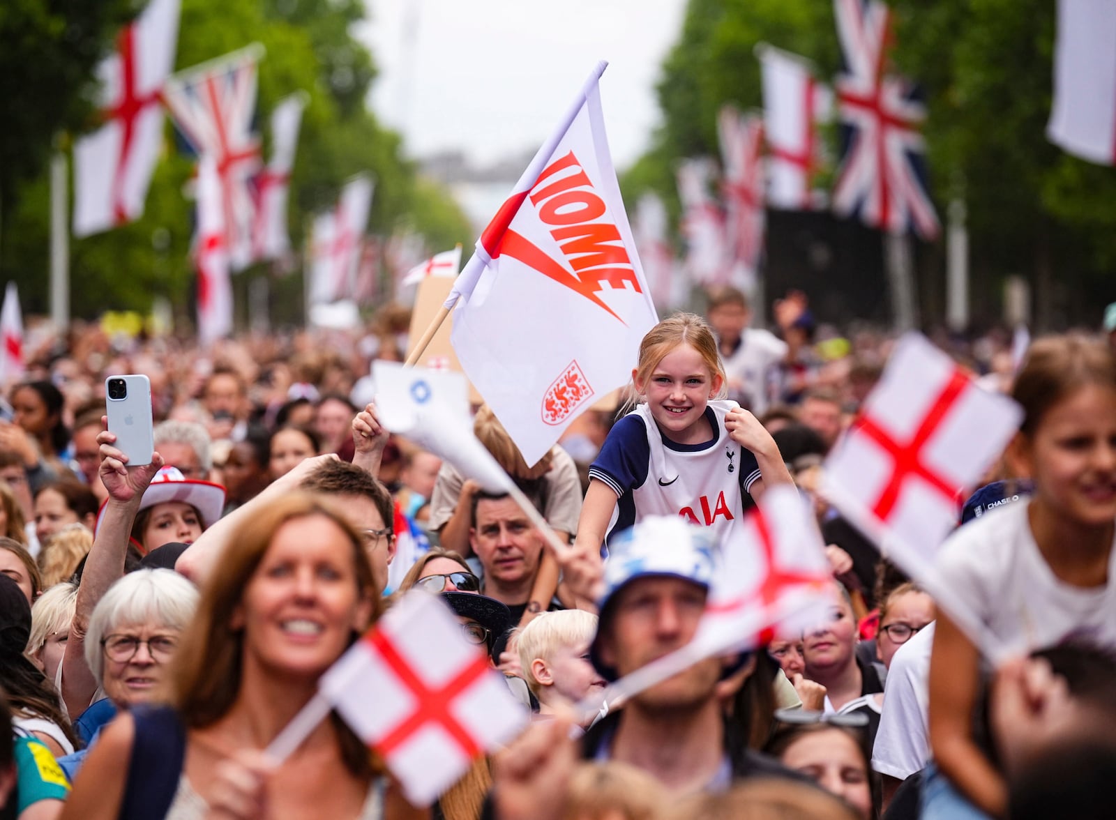 Fans gather during a Homecoming Victory Parade in London, Tuesday July 29, 2025, two days after England defended their European Championship crown as they beat Spain on penalties in the final of Euro 2025. (James Manning/PA via AP)