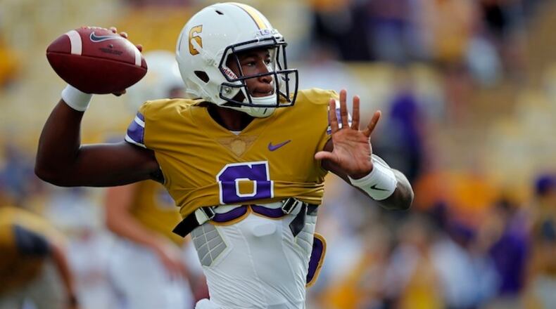 FILE- This Sept. 17, 2016 file photo shows LSU quarterback Brandon Harris (6) warming up before an NCAA college football game against Mississippi State in Baton Rouge, La. Harris rarely looked like the four-star recruit he was out of high school during his three seasons at LSU, completing 53.7 percent of his passes in 22 games (15 starts). LSU's plodding offense did Harris no favors. At North Carolina, the spread offense Larry Fedora runs should be more to Harris' liking. (AP Photo/Gerald Herbert, file)