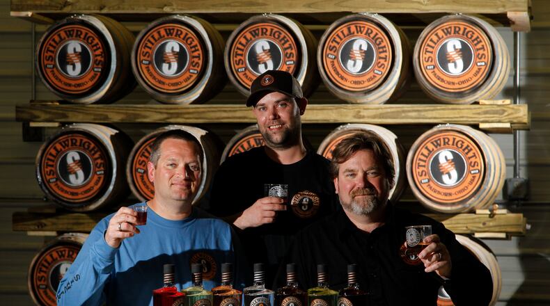 Shawn Measel, James Bagford and Brad Measel (left to right), the owners of Flat Rock Spirits in Fairborn, will launch seven new brands of spirts that will be available under their Stillwrights brand, at five local grocery and liquor stores starting June 1. LISA POWELL / STAFF