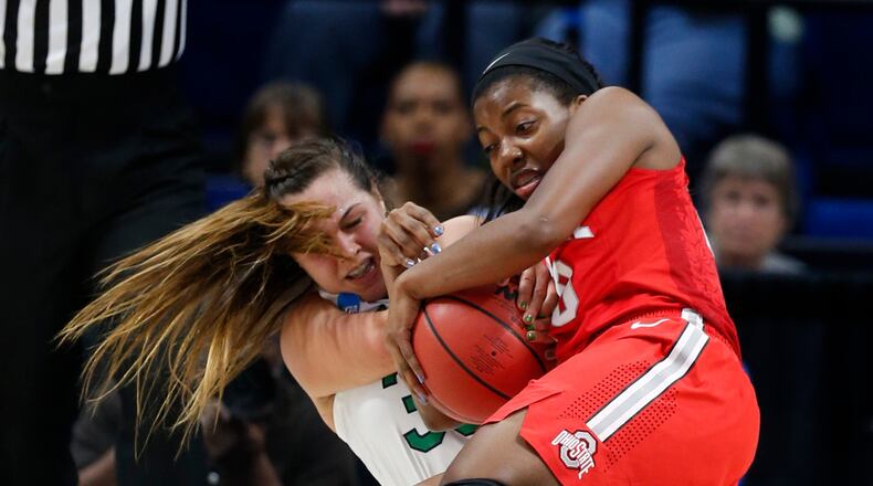 Ohio State’s Kiara Lewis, right, tangles with Notre Dame’s Kathryn Westbeld in the first half during a regional semifinal of the NCAA Tournament at Rupp Arena in Lexington, Ky., on Friday, March 24, 2017. Notre Dame advanced, 99-76. (Eric Albrecht/Columbus Dispatch/TNS)