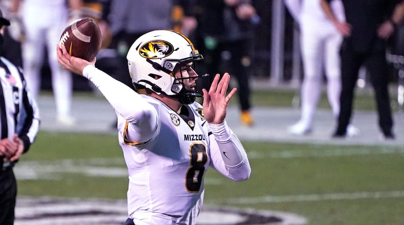 Missouri quarterback Connor Bazelak (8) passes against Mississippi State during the second half of an NCAA college football game, Saturday, Dec. 19, 2019, in Starkville, Miss. (AP Photo/Rogelio V. Solis)
