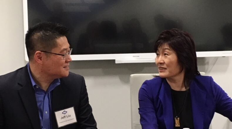 Jeff Liu, president of Fuyao Glass America (left), speaks with Ambassador Zhang Qiyue, Chinese consul general in New York, at Fuyao’s Moraine plant Thursday. The ambassador met with more than a dozen Dayton-area business and political leaders at the plant. THOMAS GNAU/STAFF