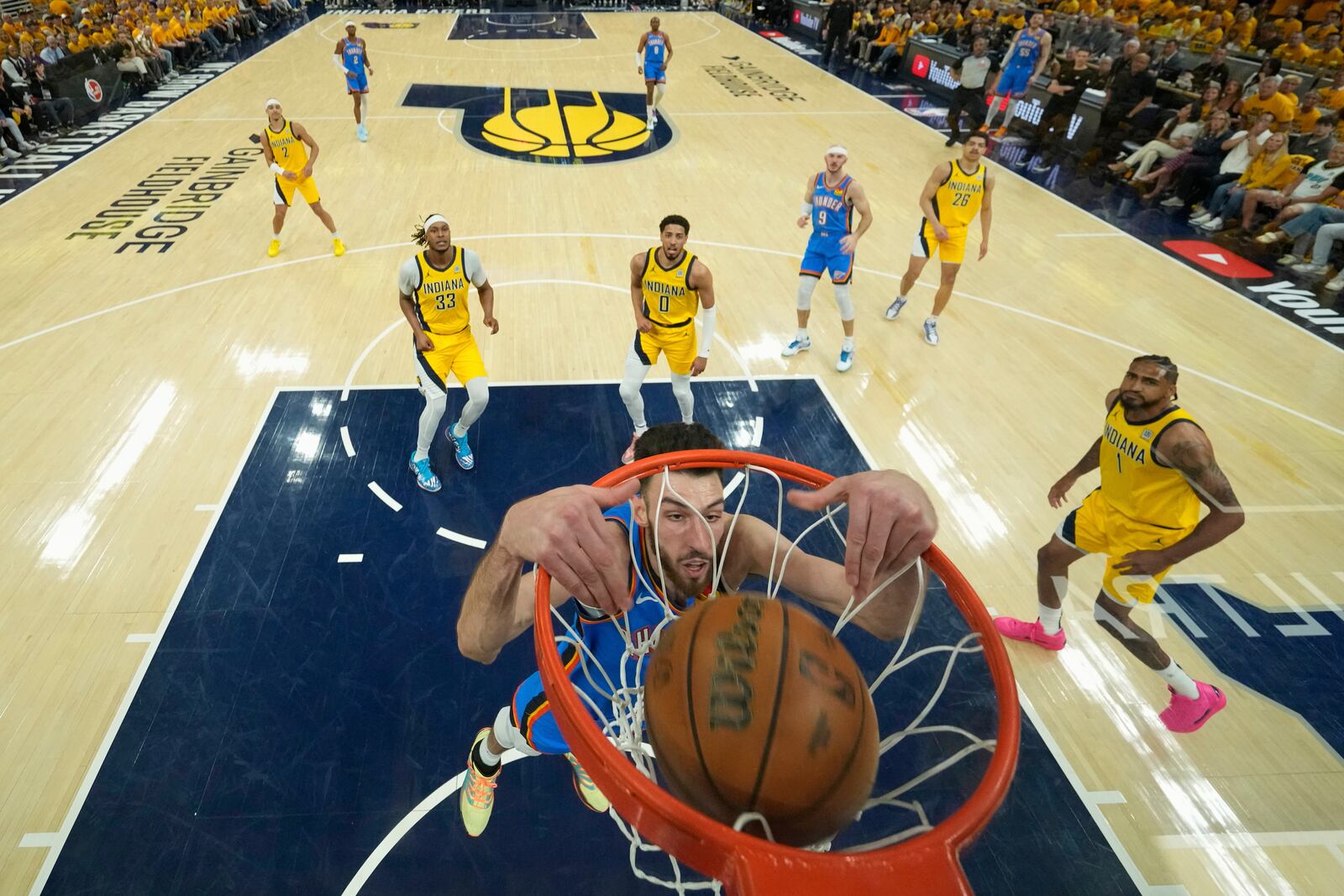 Oklahoma City Thunder forward Chet Holmgren (7) dunks against the Indiana Pacers during the first half of Game 3 of the NBA Finals basketball series, Wednesday, June 11, 2025, in Indianapolis. (AP Photo/Abbie Parr)