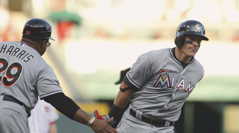 The Marlins’ Derek Dietrich rounds the bases after a home run against the Reds in the fourth inning on Saturday, June 20, 2015, at Great American Ball Park in Cincinnati. David Jablonski/Staff