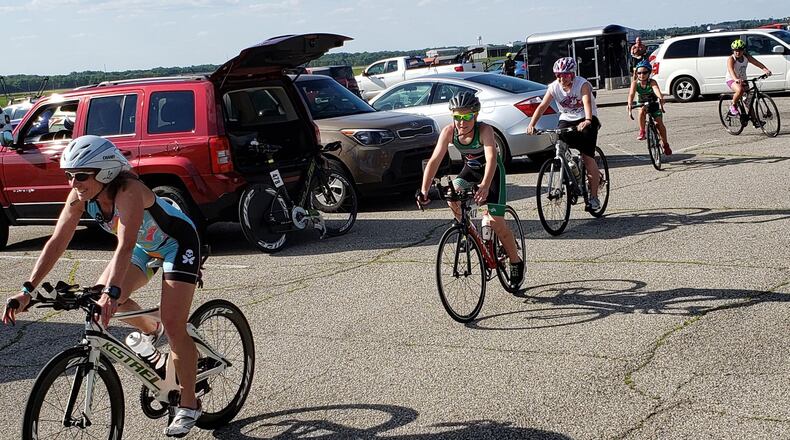Coach Cheryl Chaney of Troy leads her team of young riders as they pedal through the Area A Tennis Club parking lot before the June 11 Blue Streak time trial at Wright-Patterson Air Force Base. (Courtesy photo/Chuck Smith)