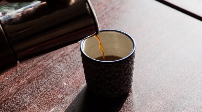 FILE-- Coffee is poured into a cup in New York, Feb. 5, 2016. The coffee industry is mulling how to fight back against a California judgeâs 2018 ruling that would require the beverage to be branded with cancer warning labels. The National Coffee Association, whose members include Starbucks and Dunkinâ Donuts, said that it was âcurrently considering all of its options, including potential appeals and further legal actions.â (Alex Welsh/The New York Times)