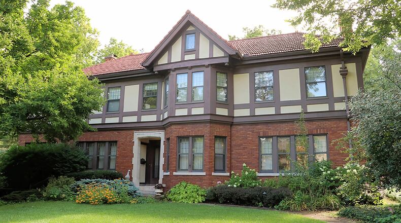 The stately Tudor at has about 5,200 sq. ft. of living space with 5 bedrooms and a walk-out lower level. Nestled within a hillside on one of the larger lots, the home has a paved driveway that leads to an electric gate. CONTRIBUTED PHOTO BY KATHY TYLER