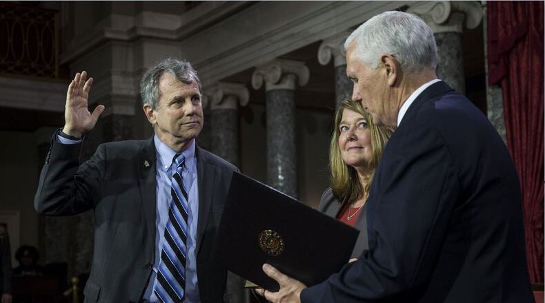 WASHINGTON, DC - Sen. Sherrod Brown (D-OHIO) participates in a mock swearing-in ceremony with Vice President Mike Pence on Capitol Hill on January 3, 2019, in Washington. (Photo by Zach Gibson/Getty Images)