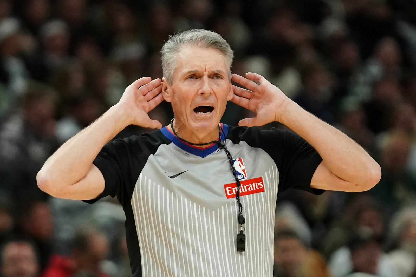 FILE - Referee Scott Foster (48) gestures during the second half of an NBA basketball game between the Milwaukee Bucks and the Philadelphia 76ers, Jan. 19, 2025, in Milwaukee. (AP Photo/Aaron Gash, File)