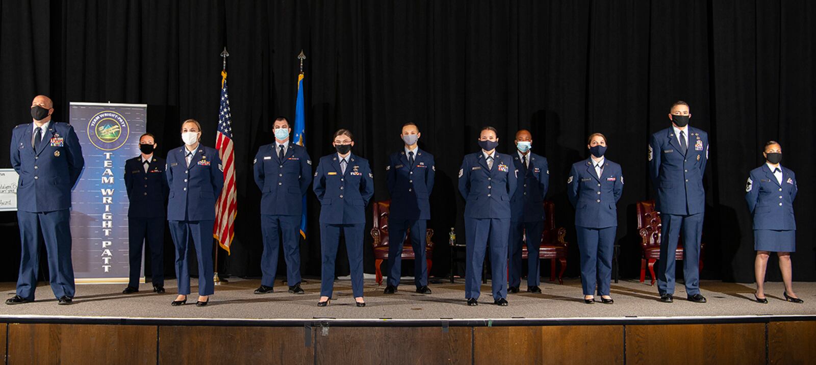 Eight Community College of the Air Force graduates pose with Col. Patrick Miller, 88th Air Base Wing and installation commander; Chief Master Sgt. Jason Shaffer, 88th ABW command chief; and Chief Master Sgt. Arwa Cavendar, 88th Medical Support Squadron superintendent, after their graduation ceremony Nov. 19 at the National Museum of the Air Force. Only eight of the 29 graduates were able to attend due to the pandemic and no guests were allowed. U.S. AIR FORCE PHOTO/R.J. ORIEZ