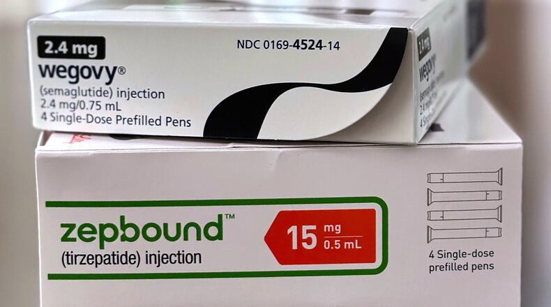 FILE - Boxes for the medications Wegovy and Zepbound are arranged for a photograph in California, May 8, 2025. (AP Photo/JoNel Aleccia, File)